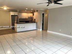 9350 Southwest 77th Avenue, Unit G8 Miami, FL 33156 - Photo 3 of 11 a view of a room with a projector and living room