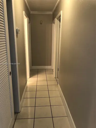 a view of a utility room with windows