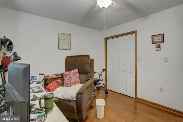 a workspace with furniture and wooden floor