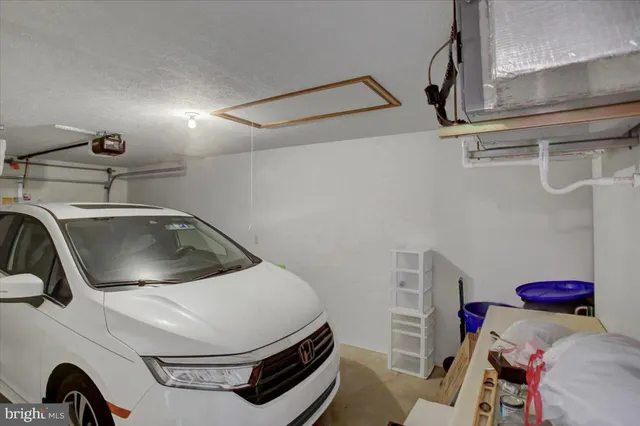 a utility room with sink dryer and washer