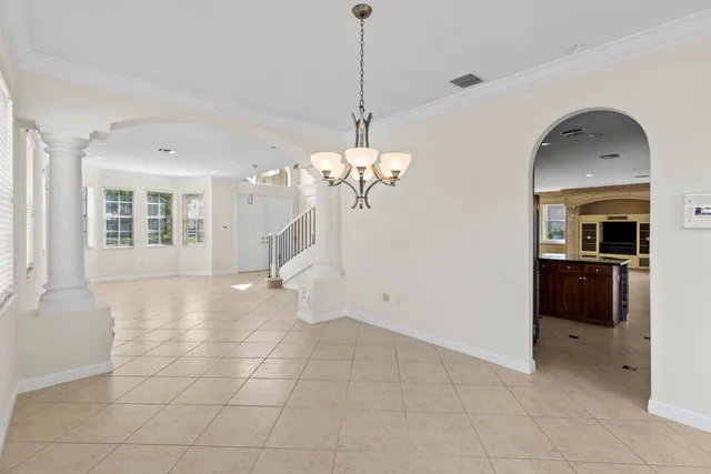 a kitchen with stainless steel appliances a refrigerator sink and cabinets