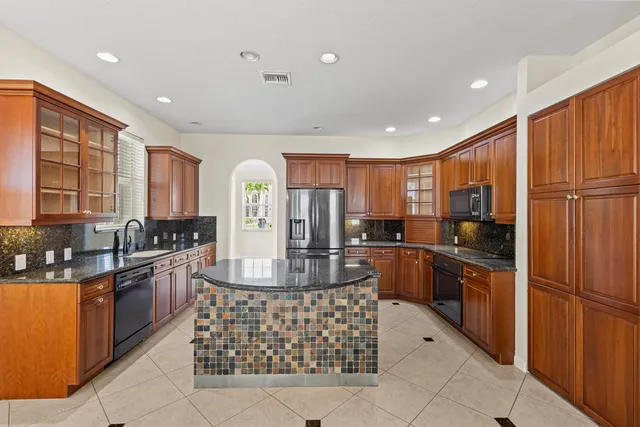 a view of an empty room with a fireplace