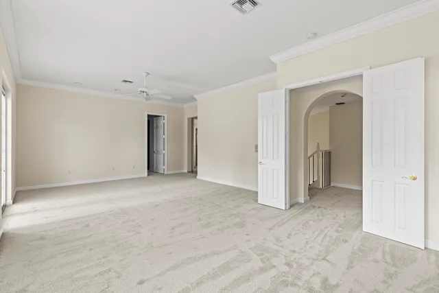 an aerial view of a house with a yard and garden
