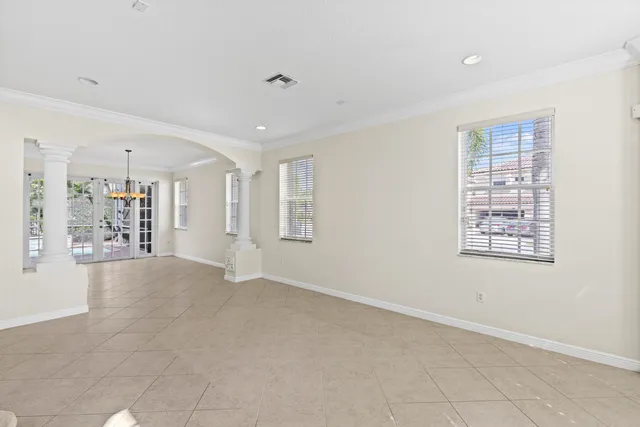 a view of an empty room with windows