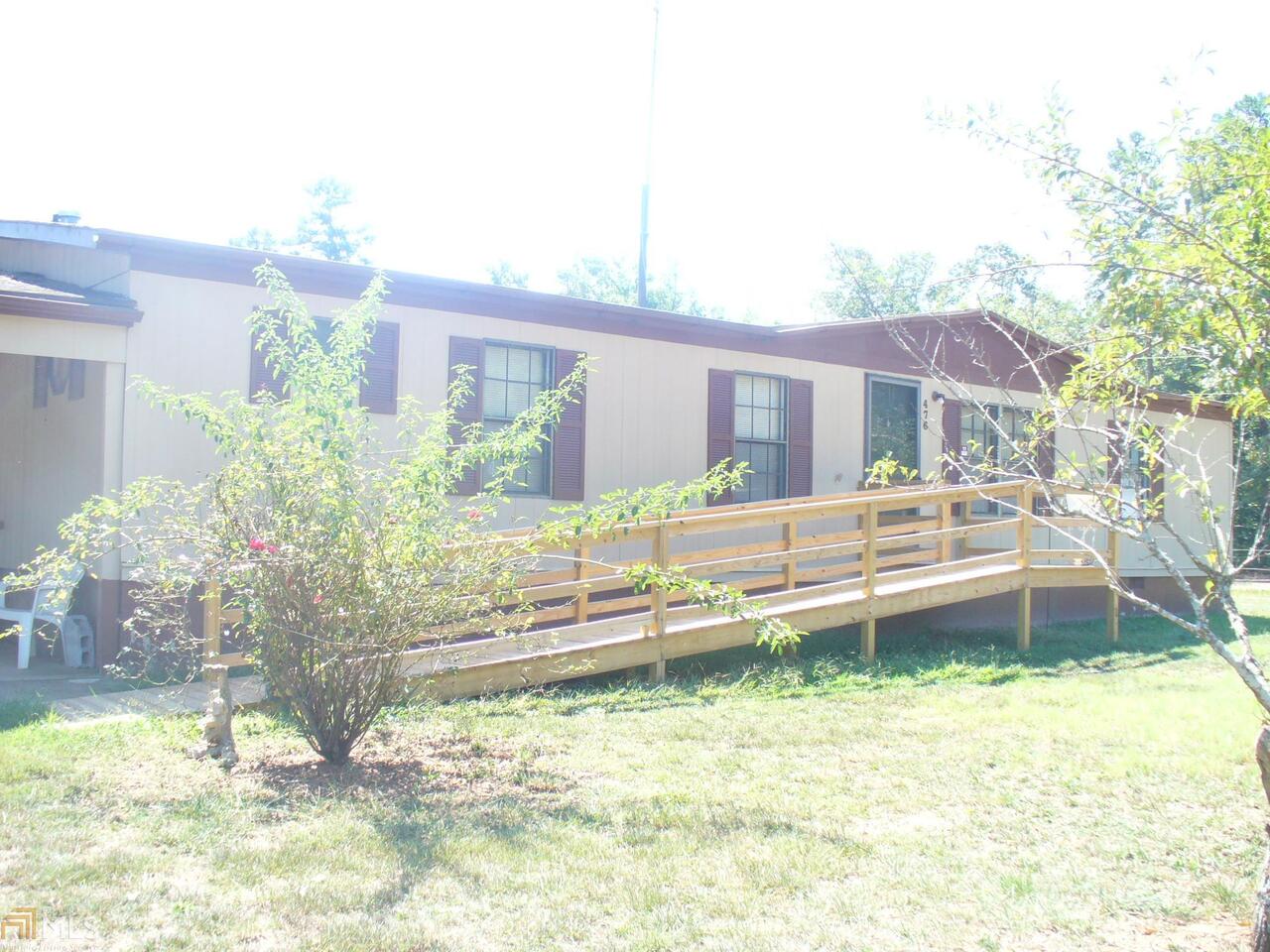 476 Blacks Creek Church Road Commerce, GA 30530 - Photo 1 of 1 a backyard of a house with yard fire pit and outdoor seating