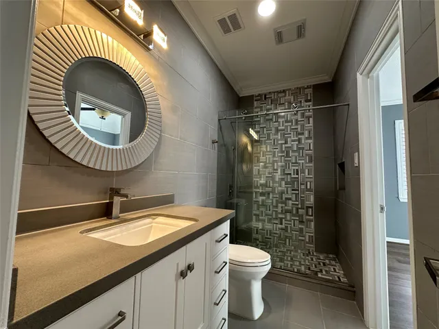 a view of a room with wooden floor and windows