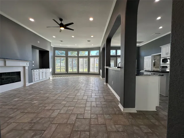 a kitchen with stainless steel appliances granite countertop a stove and white cabinets