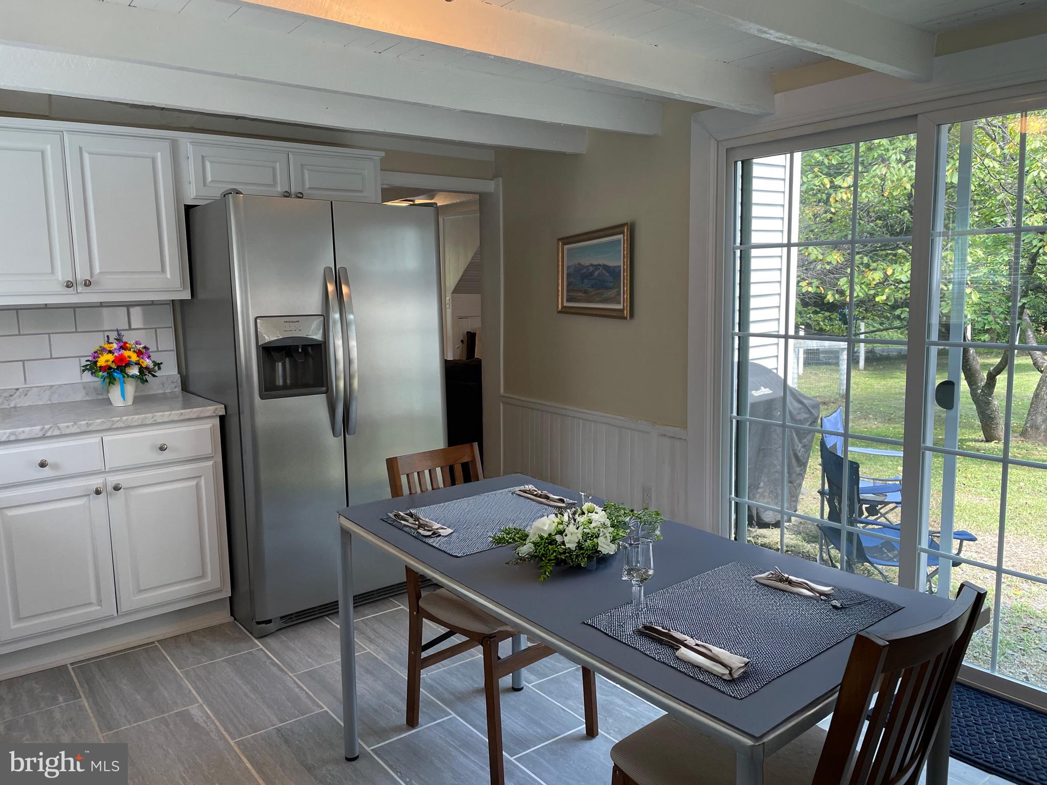 41809 Stumptown Road Leesburg, VA 20176 - Photo 8 of 29 Walk into kitchen from sliding glass door.