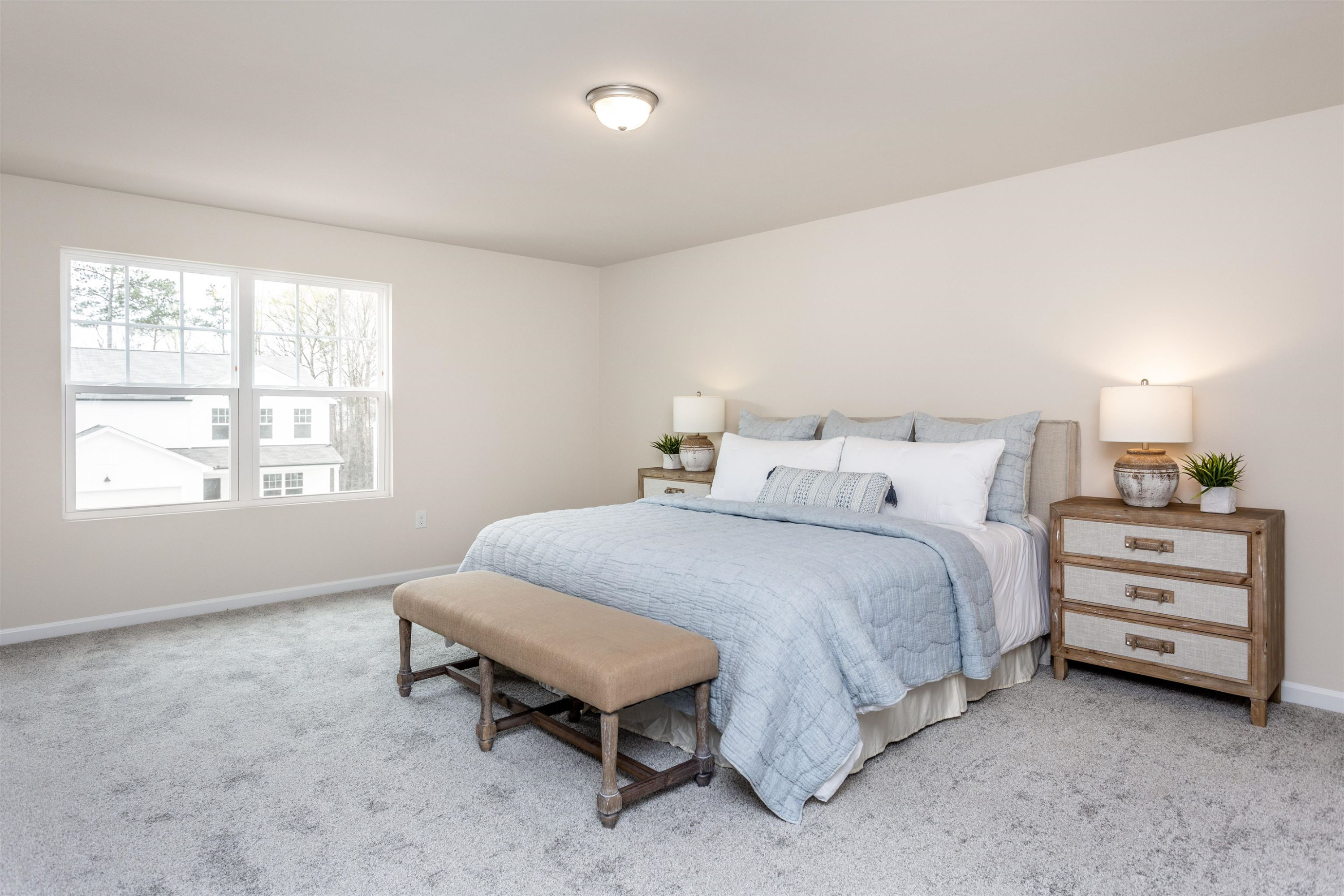 1716 Arapahoe Ridge Drive Raleigh, NC 27604 - Photo 15 of 21 a spacious bedroom with a bed and a window