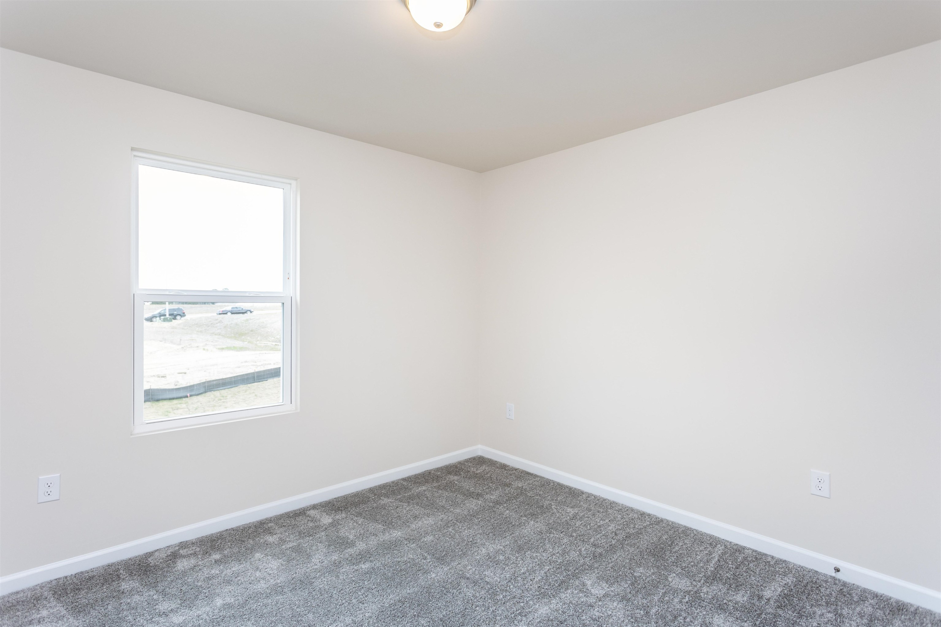 1716 Arapahoe Ridge Drive Raleigh, NC 27604 - Photo 20 of 21 an empty room with a window