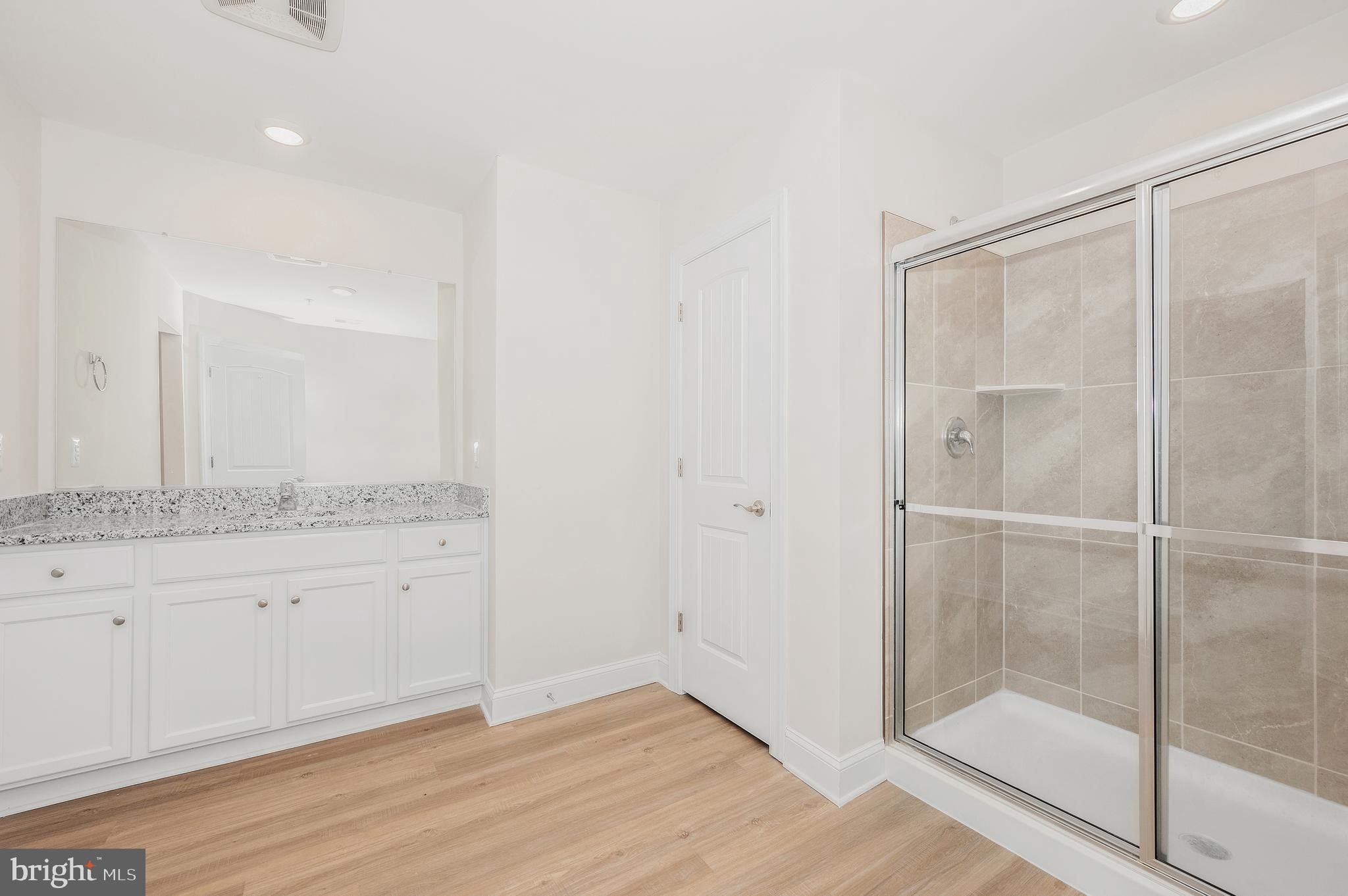 9962 Roulette Drive Hagerstown, MD 21740 - Photo 24 of 43 a bathroom with a granite countertop sink and a mirror