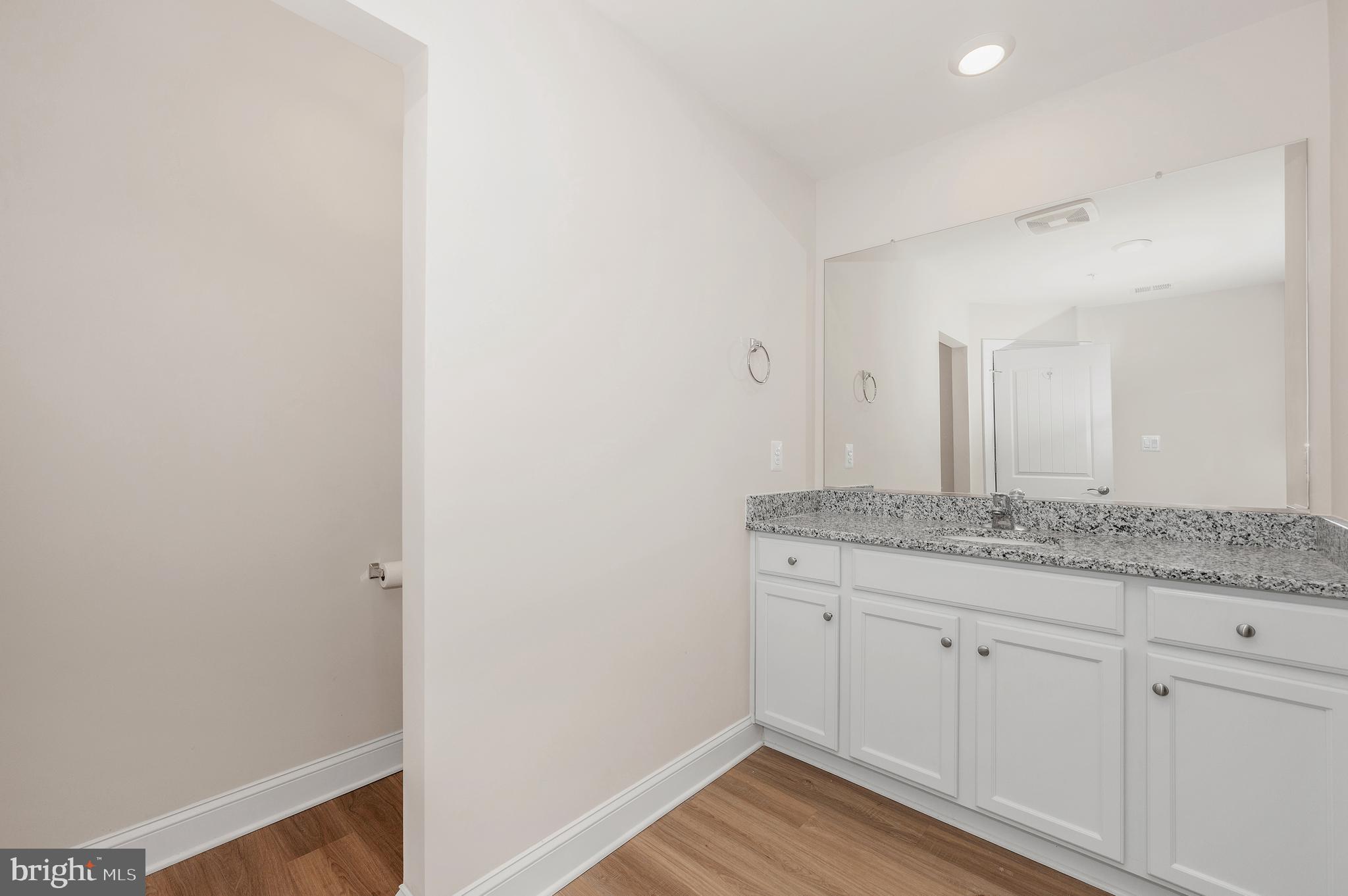 9962 Roulette Drive Hagerstown, MD 21740 - Photo 25 of 43 a bathroom with a granite countertop sink and a mirror