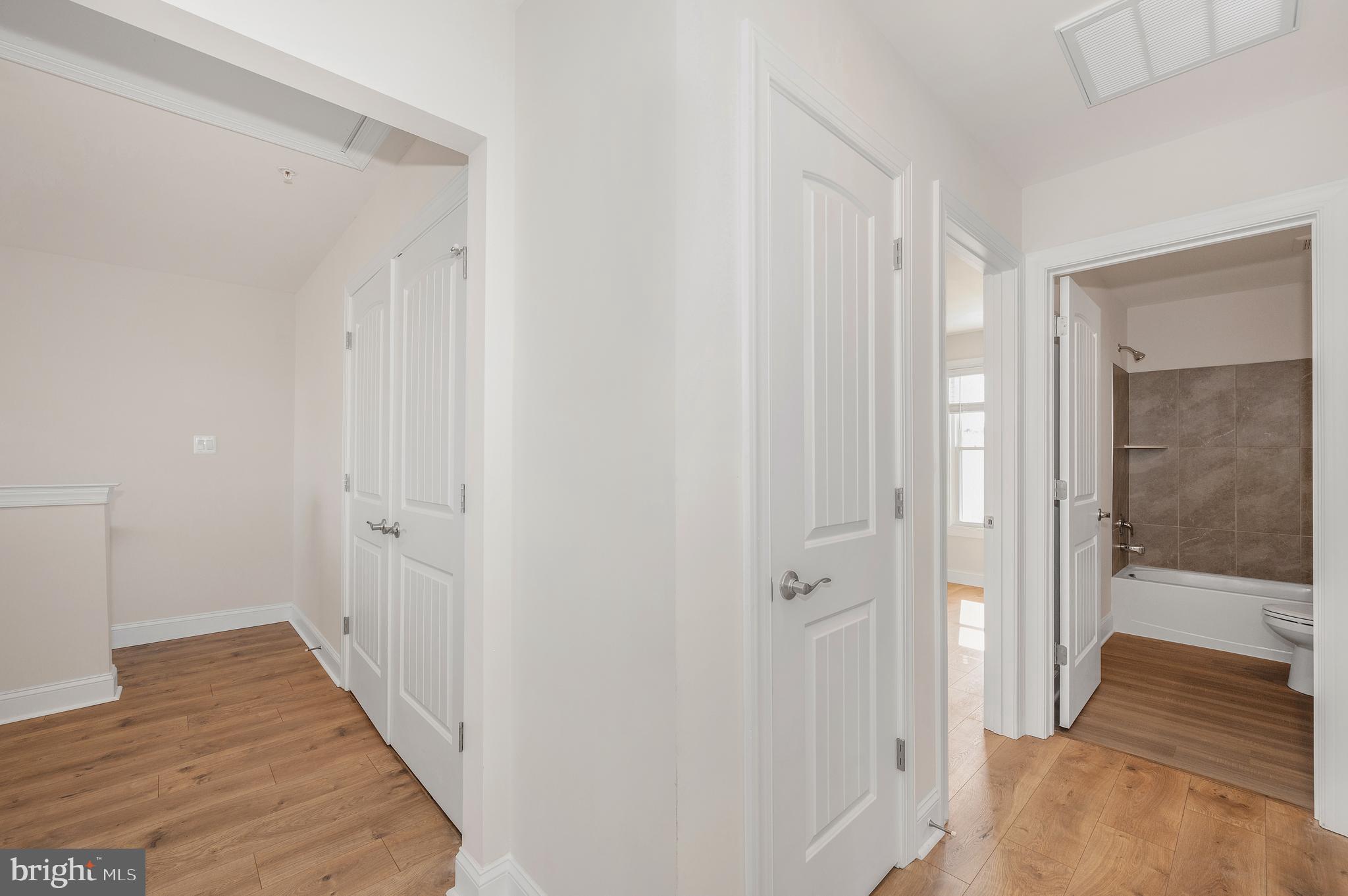 9962 Roulette Drive Hagerstown, MD 21740 - Photo 27 of 43 a view of a hallway with wooden floor