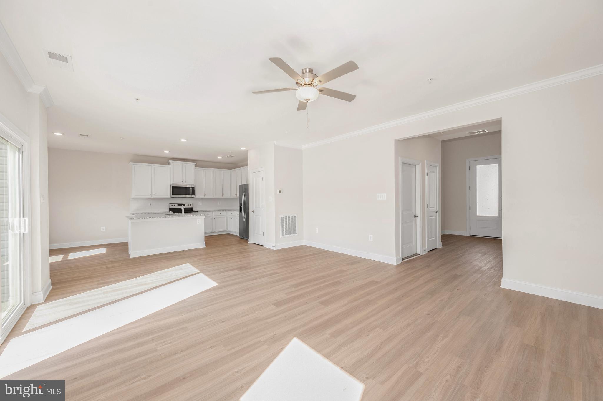 9962 Roulette Drive Hagerstown, MD 21740 - Photo 4 of 43 a view of a kitchen with a sink and wooden cabinet