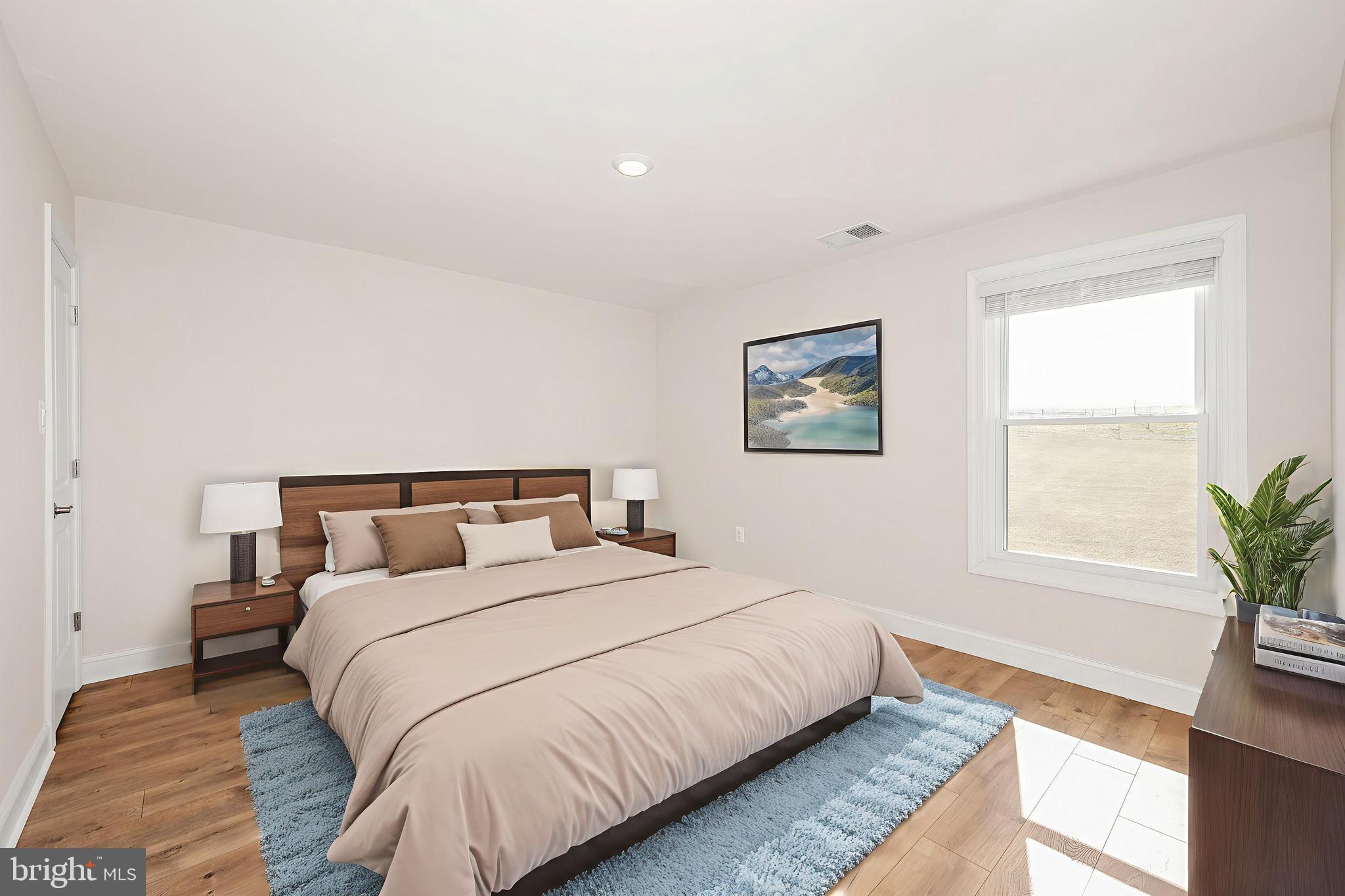 9962 Roulette Drive Hagerstown, MD 21740 - Photo 5 of 43 a bedroom with bed and a potted plant on dresser