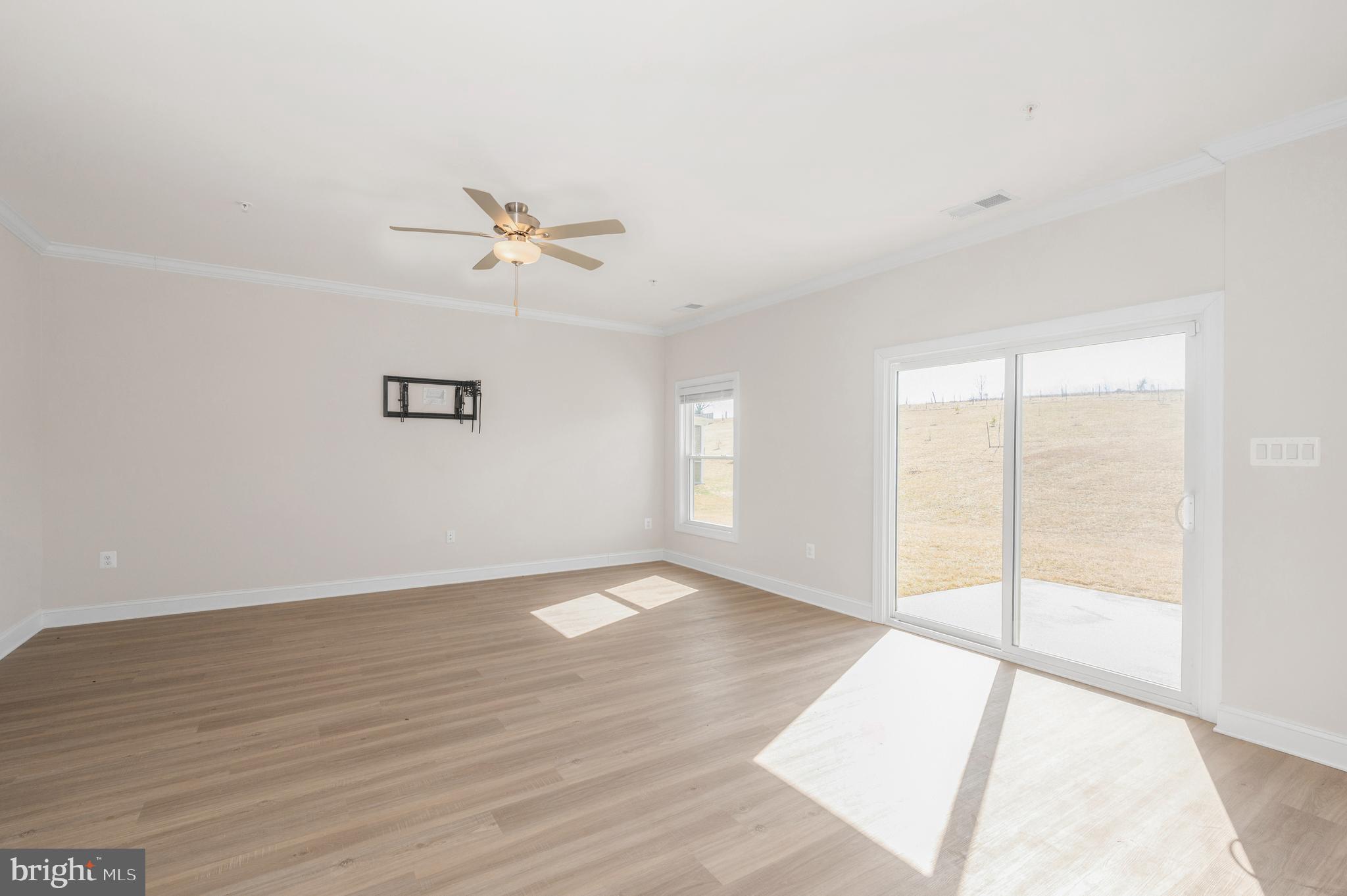 9962 Roulette Drive Hagerstown, MD 21740 - Photo 8 of 43 wooden floor in an empty room with a window