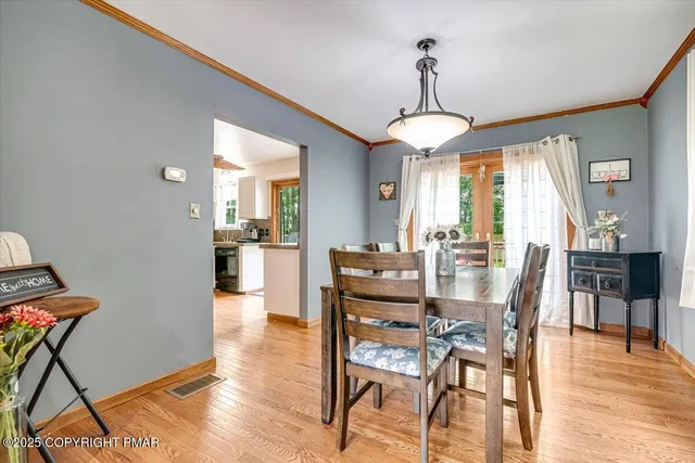 a kitchen with granite countertop a stove a sink and a refrigerator