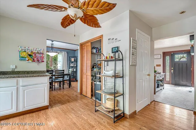 a view of a livingroom with workspace and a window