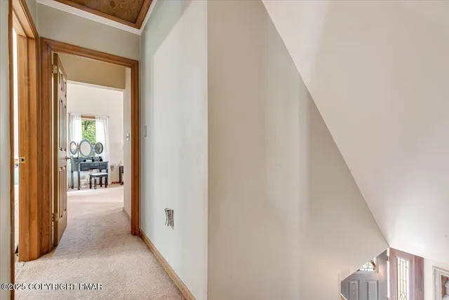 a bathroom with a tub a sink and a window