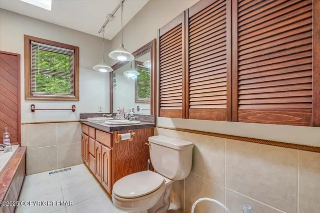 a bedroom with a bed and a tv