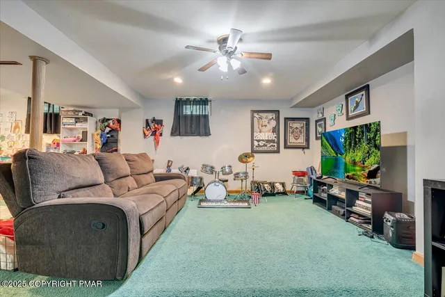 an aerial view of a house with swimming pool garden and patio