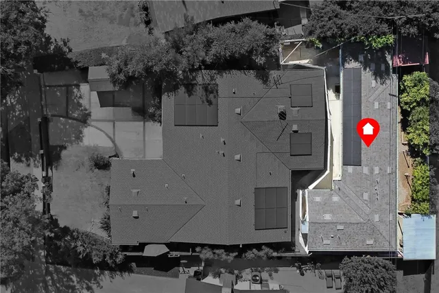 an aerial view of a house with a fireplace