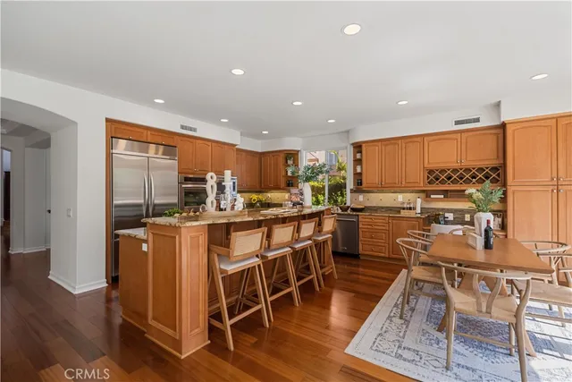 a kitchen with stainless steel appliances granite countertop a sink and cabinets
