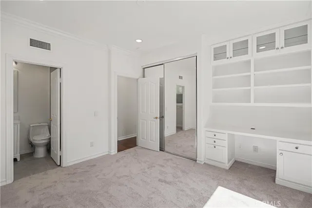 a view of a house with a sink and outdoor kitchen
