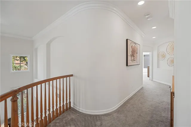 a spacious bathroom with a tub sink and mirror