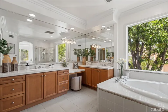a view of entrance gate of a house with a garden