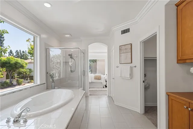 an aerial view of house with yard and mountain view in back