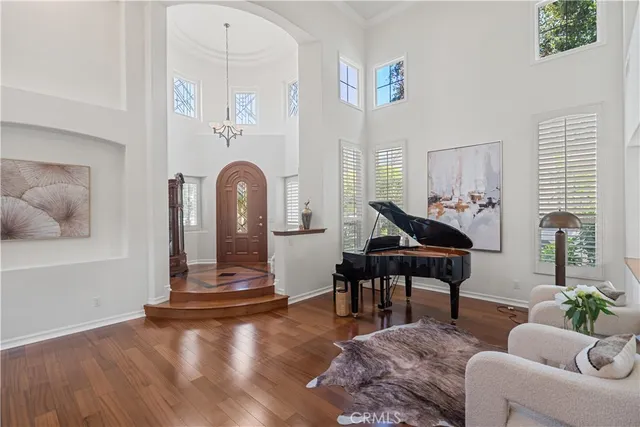 a view of entryway and hall with wooden floor