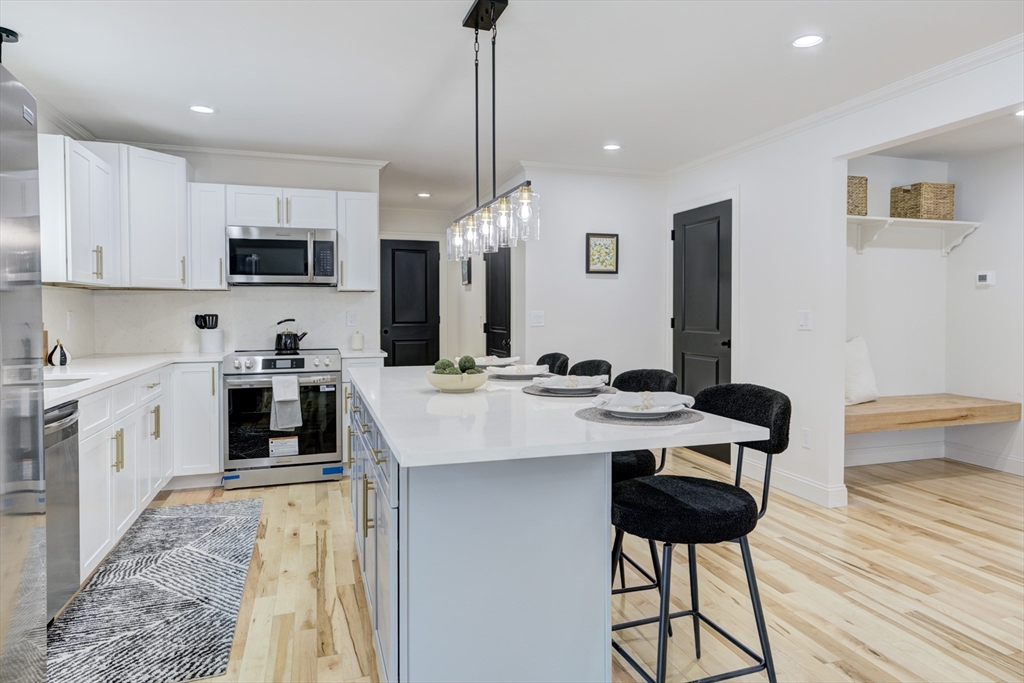 6 Winslow Road Ware, MA 01082 - Photo 1 of 34 a kitchen with a sink stove and refrigerator