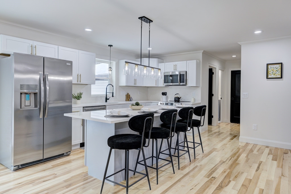 6 Winslow Road Ware, MA 01082 - Photo 2 of 34 a kitchen with kitchen island granite countertop a sink cabinets and stainless steel appliances