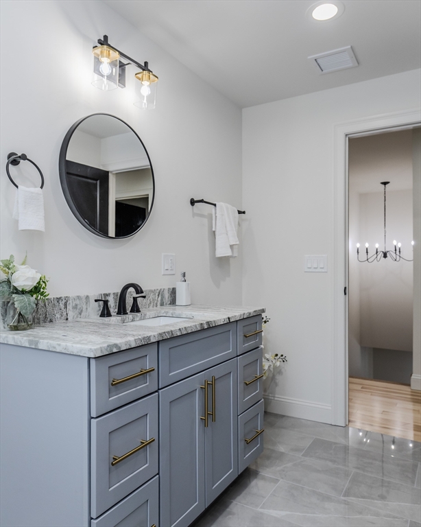 6 Winslow Road Ware, MA 01082 - Photo 26 of 34 a bathroom with a granite countertop sink and a mirror