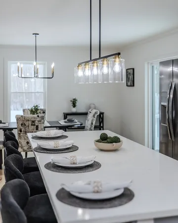a dining room with furniture and chandelier