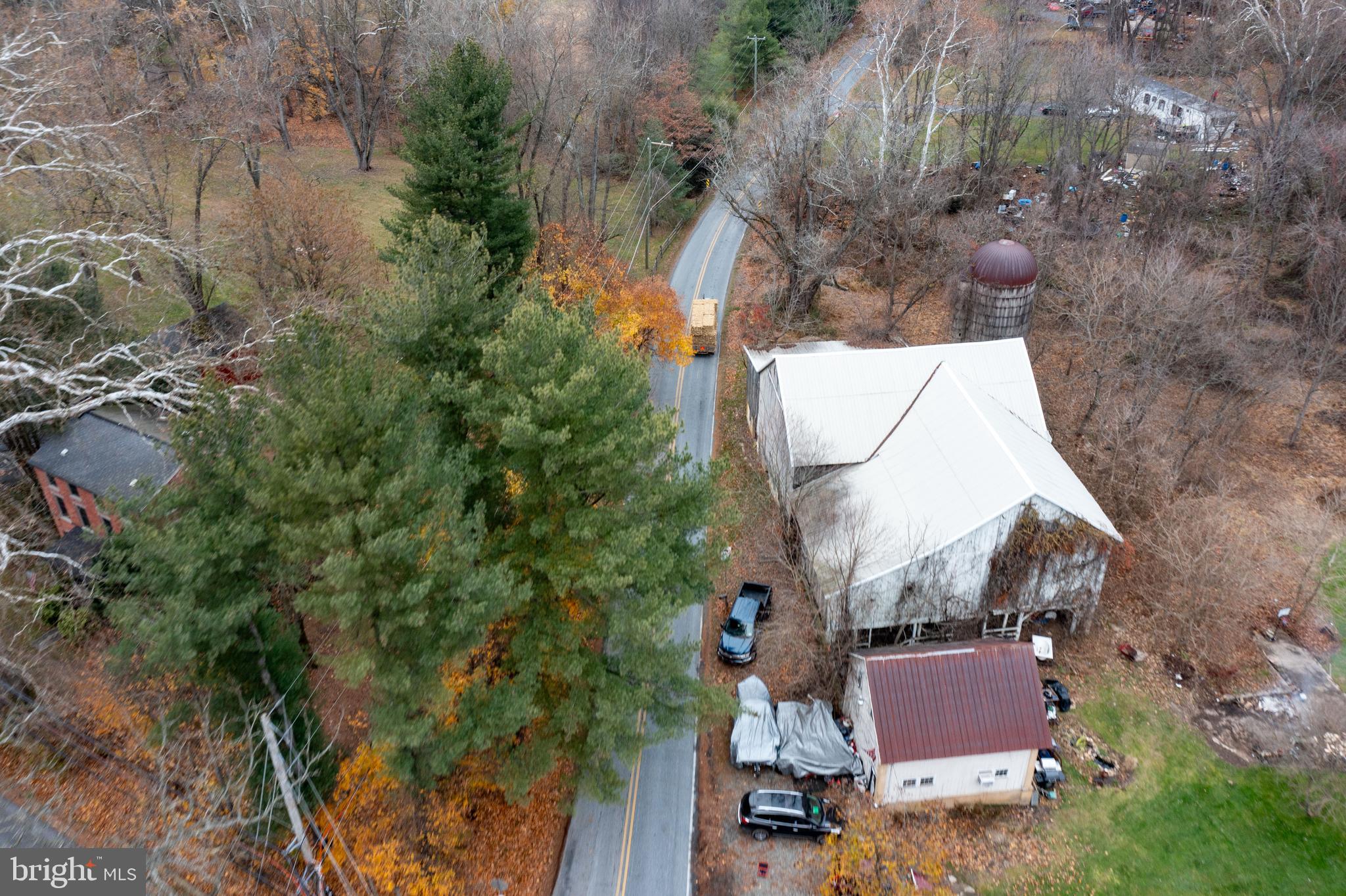 580 Elkdale Road Lincoln University, PA 19352 - Photo 41 of 42 an aerial view of a house with outdoor space and trees all around