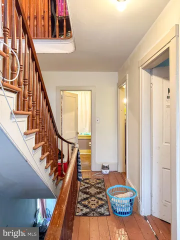 a view of an entryway with wooden floor