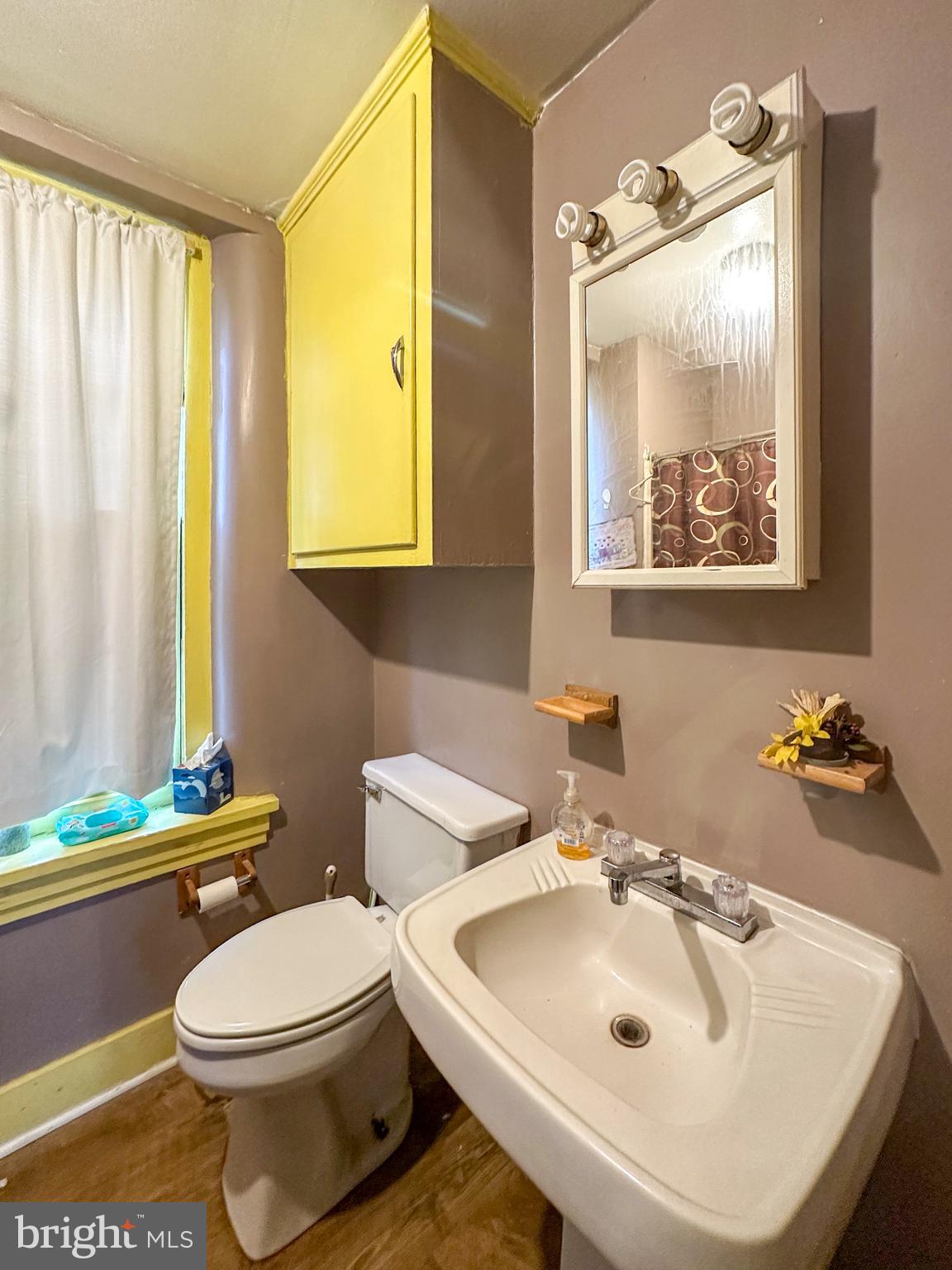 580 Elkdale Road Lincoln University, PA 19352 - Photo 6 of 42 a bathroom with a sink and mirror with toilet