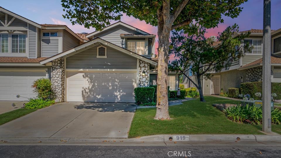 919 Bidwell Road San Dimas, CA 91773 - Photo 1 of 1 a front view of a house with a yard garage and plants