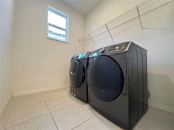 a utility room with dryer and washer