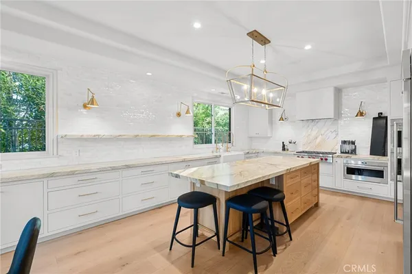 a kitchen with a stove and a microwave