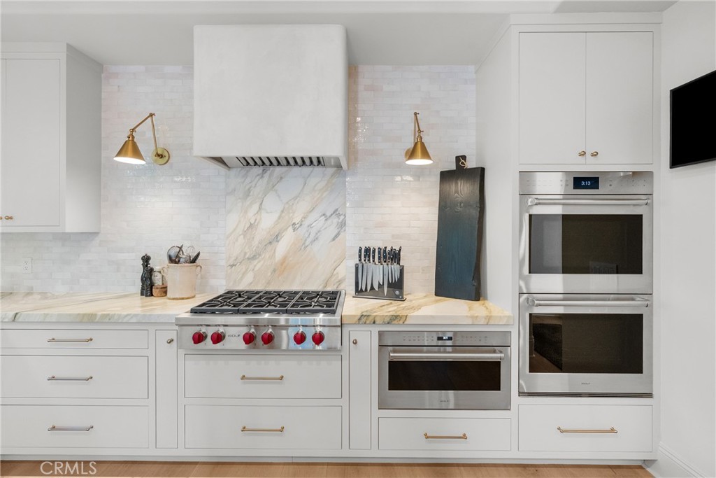 23477 Park Colombo Calabasas, CA 91302 - Photo 18 of 56 a kitchen with a stove and a microwave