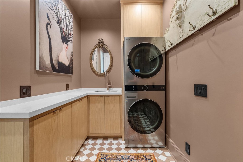 23477 Park Colombo Calabasas, CA 91302 - Photo 24 of 56 a bathroom with a sink a mirror and vanity