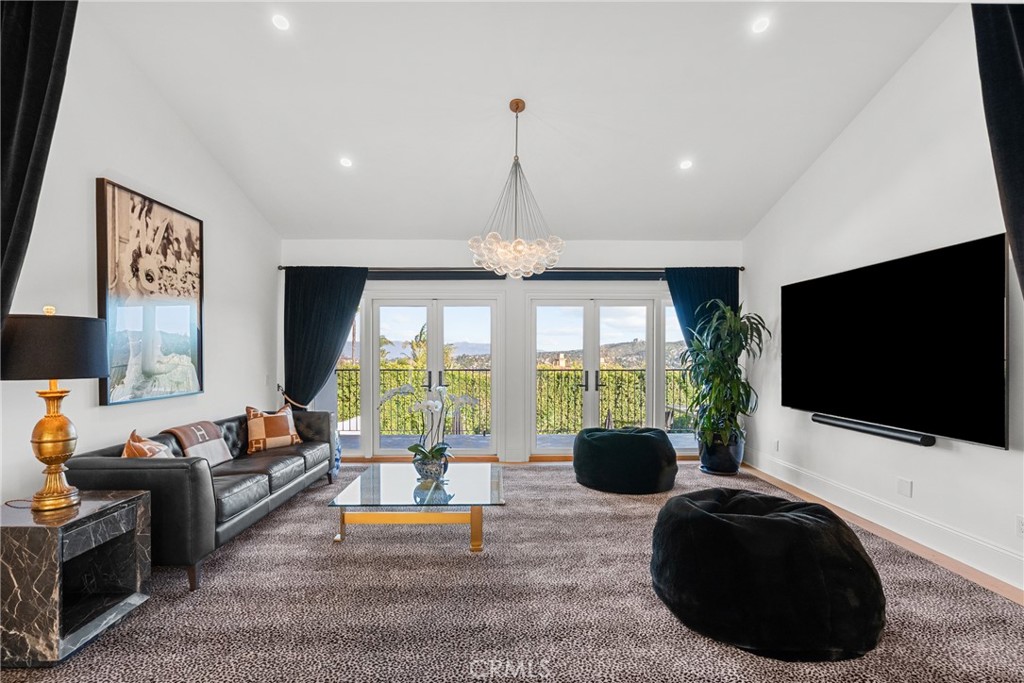 23477 Park Colombo Calabasas, CA 91302 - Photo 26 of 56 a living room with furniture and a flat screen tv
