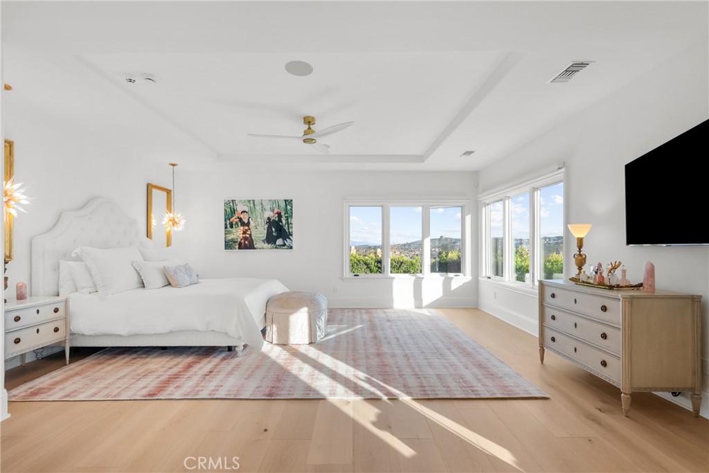 23477 Park Colombo Calabasas, CA 91302 - Photo 27 of 56 a bedroom with furniture and flat screen tv