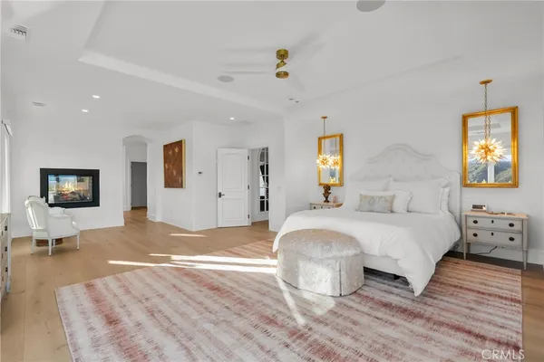 a bedroom with a bed and a book shelf