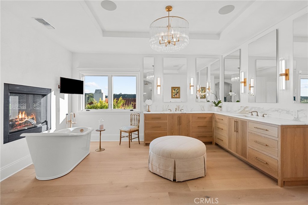 23477 Park Colombo Calabasas, CA 91302 - Photo 31 of 56 a spacious en suite bathroom with a double vanity sink and a mirror