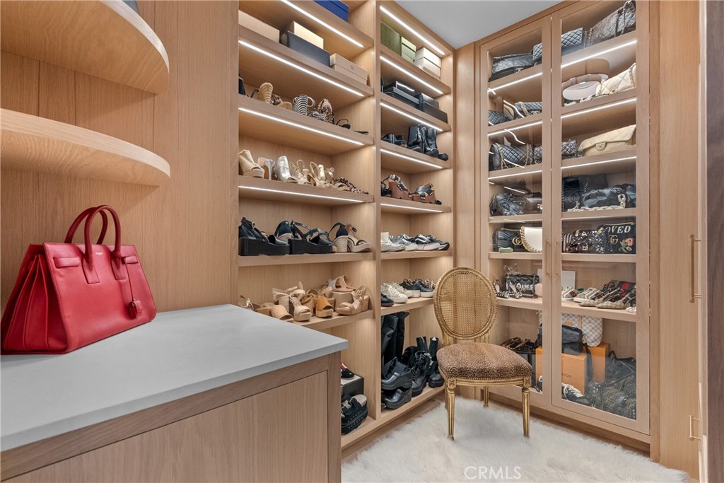 23477 Park Colombo Calabasas, CA 91302 - Photo 33 of 56 a bedroom with a bed and a book shelf