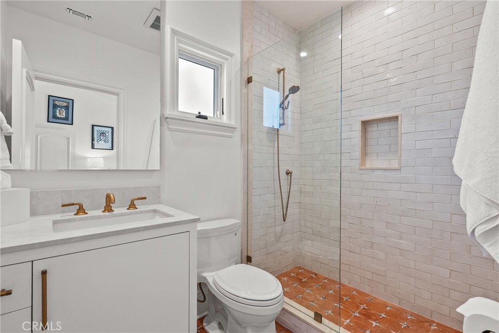23477 Park Colombo Calabasas, CA 91302 - Photo 38 of 56 a bathroom with a sink toilet vanity and shower